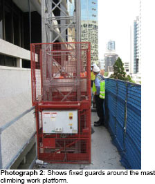 Photo 2: Shows fixed guards around the mast climbing work platform.