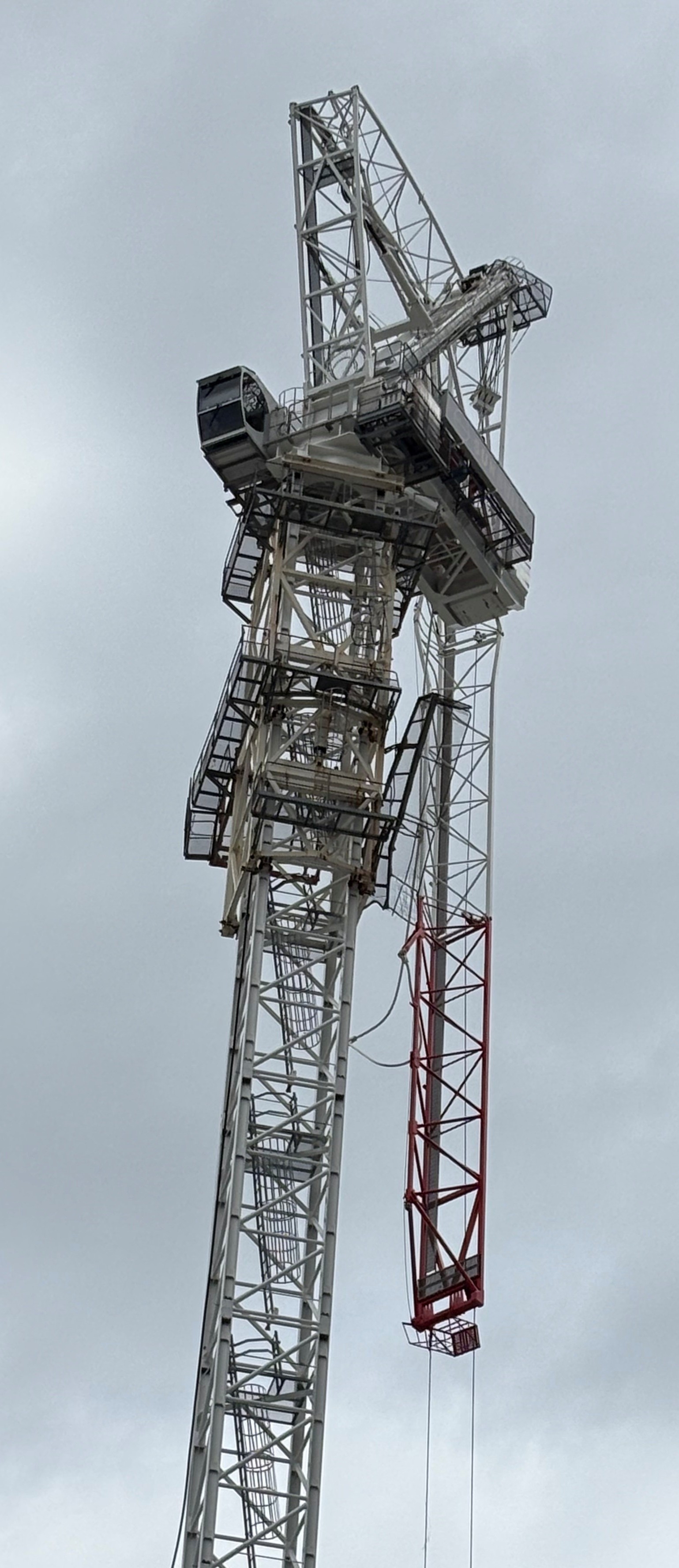 Luffing tower crane being blown backwards on a construction site on the Gold Coast